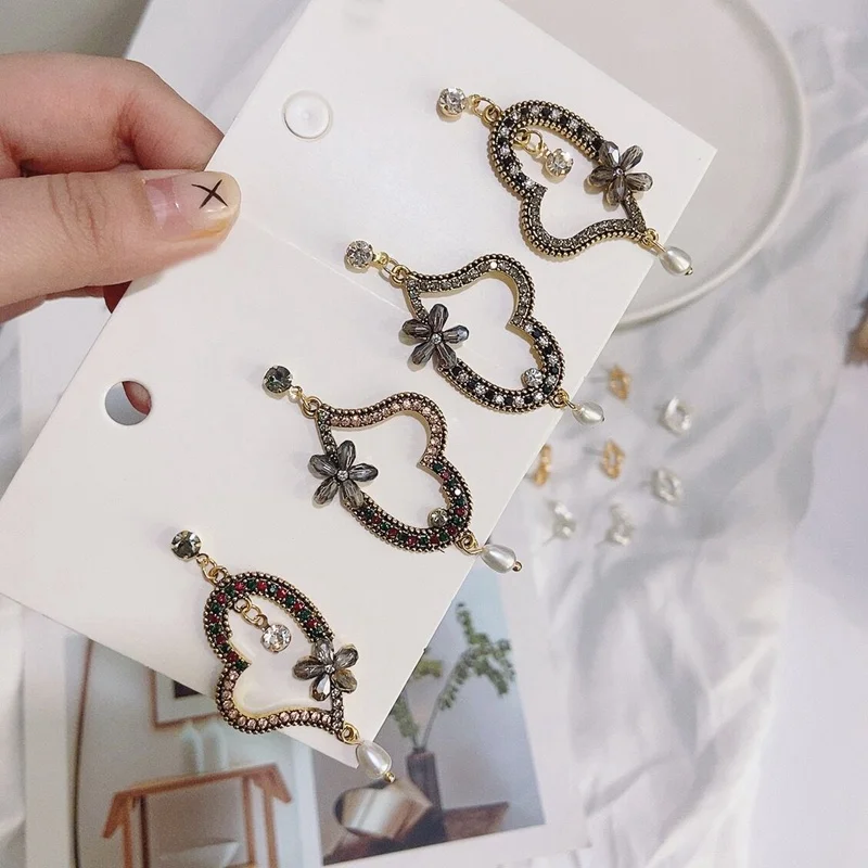

MENGJIQIAO New Vintage Hollow Rhinestone Love Heart Asymmetry Drop Earrings For Women Fashion Flower Crystal Pendientes Jewelry