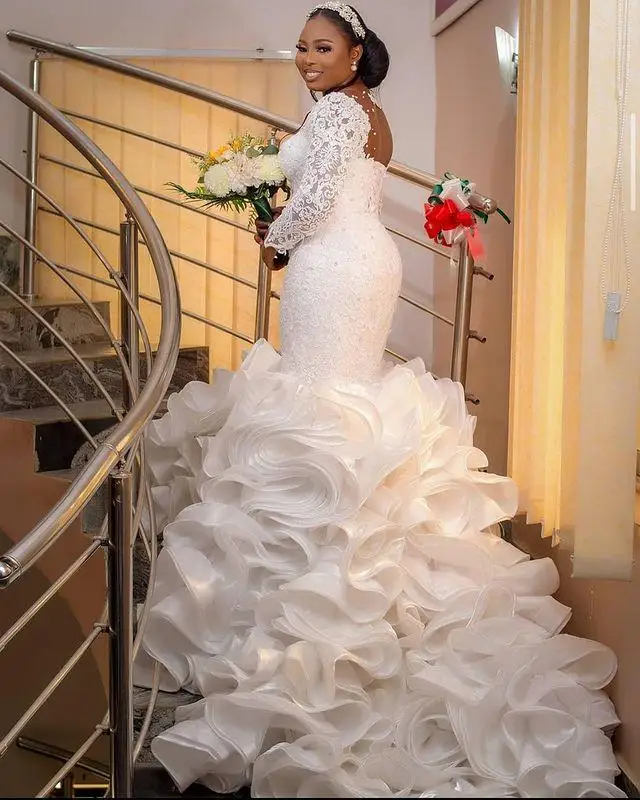 

Nigerian African Mermaid Wedding Dresses Plus Size Arabic Aso Ebi Ruffles Cathedral Train Lace Sheer Long Sleeve Bridal Dress