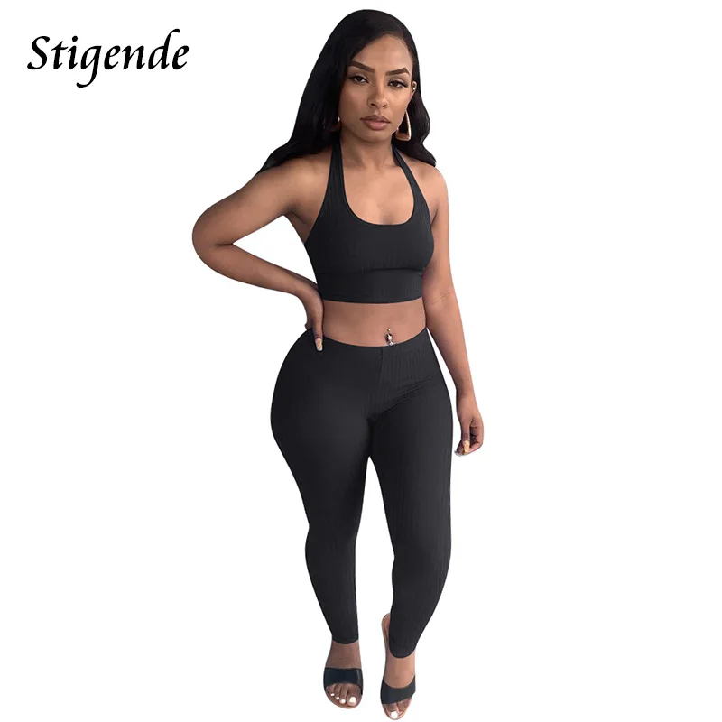 

Stigende Для женщин пикантные узкие брюки в рубчик, комплект спортивной одежды, платье с открытой спиной и лямкой на шее повязки топ и леггинсы п...