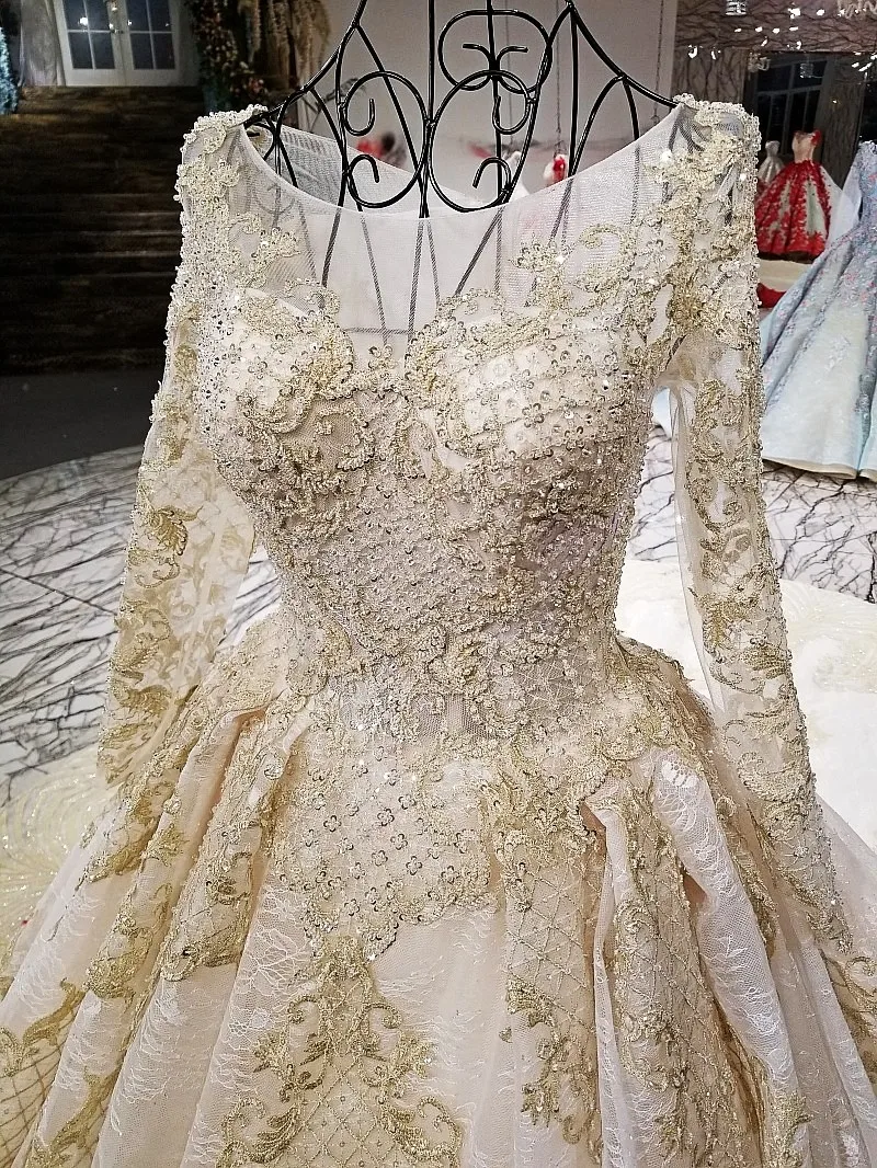 Свадебное платье цвета шампанского и золотого с длинным рукавом настоящие
