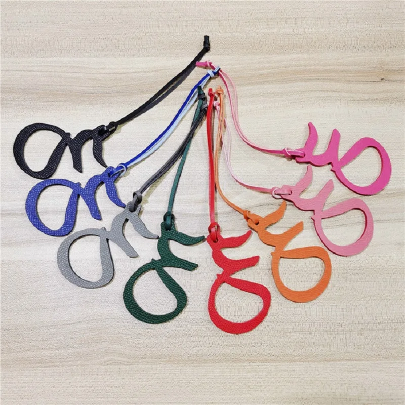 

Fashion Genuine Natural Leather Character Alphabet Arabic Letter Keychain Backpack Pendant Ladies Women Bag Charm