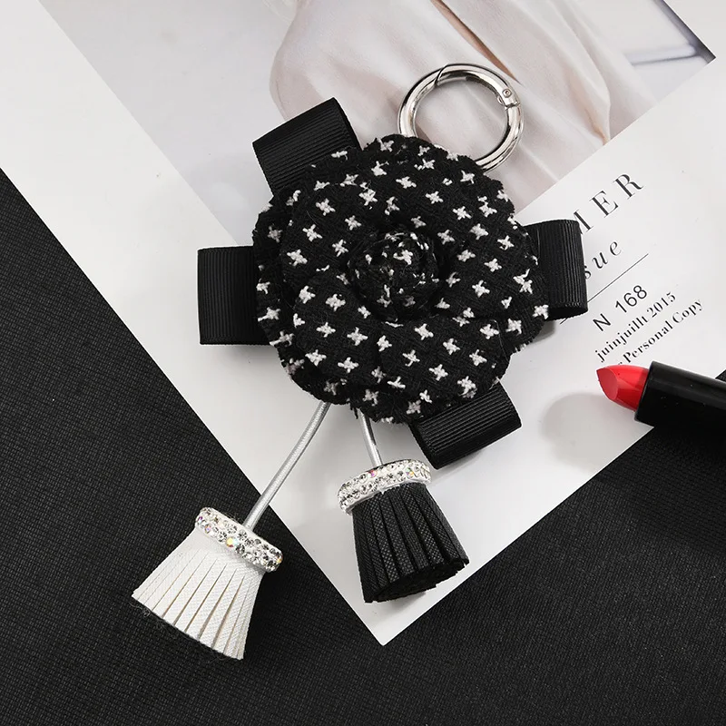 Лук брелок PU с кистями со стразами белый черный розовый гусиные лапки цветок лук