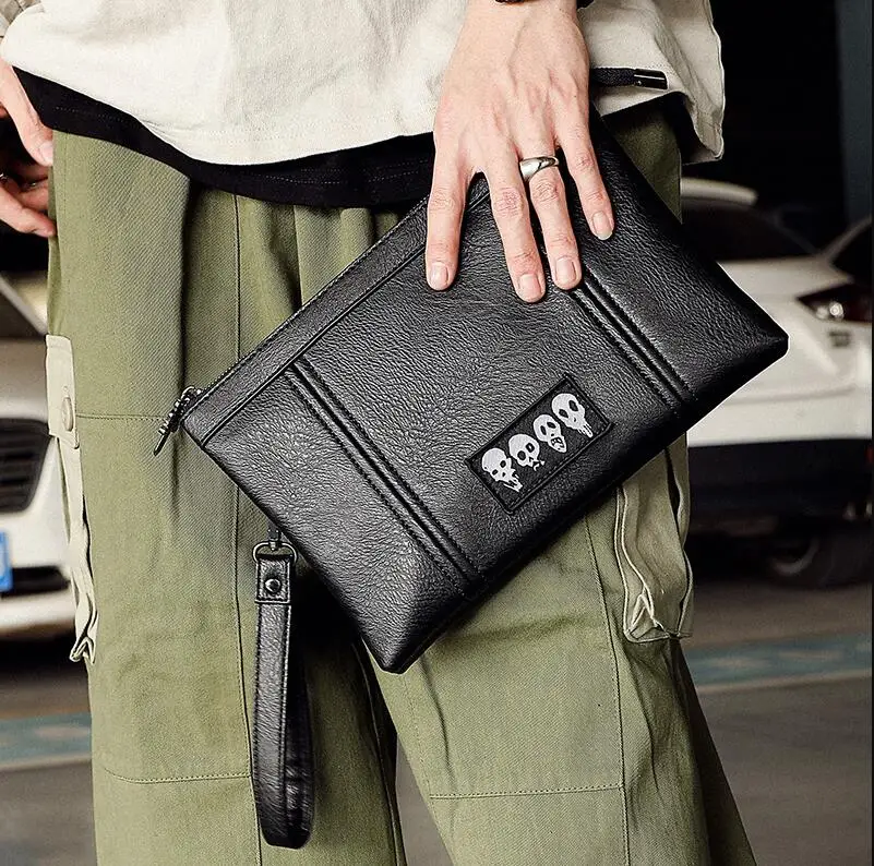

2021 Fashion Men's Handbag High Quality Luxury Leather Bag Male Business Clutch Korea Envelope Skull Bag Free Shipping