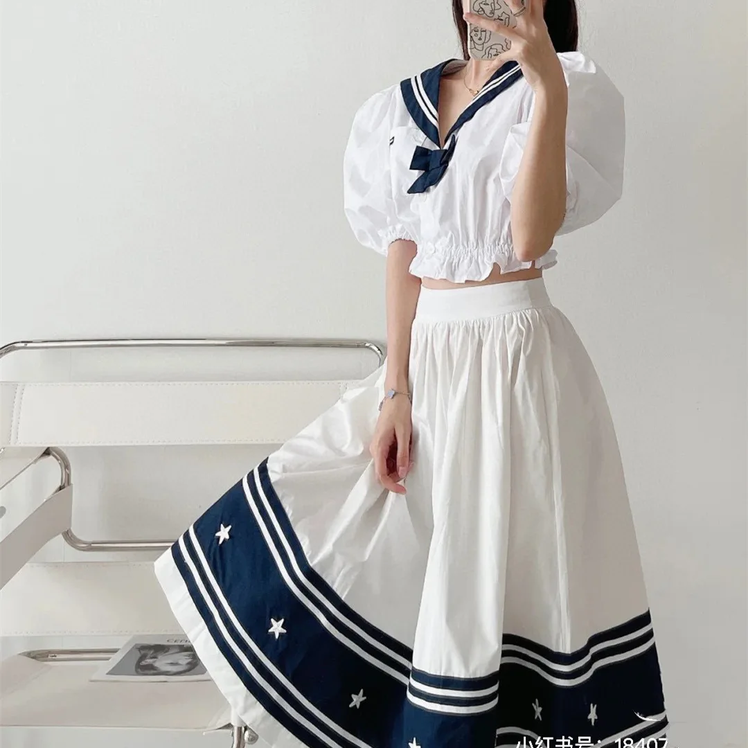 

2021 between JLMG denim skirt woman skirts