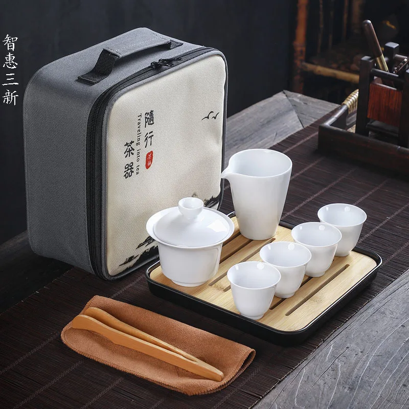 

Белый керамический дорожный чайный набор, портативный китайский дизайнерский одногоршок, четыре чашки, семейный чайный набор, подарок, инд...
