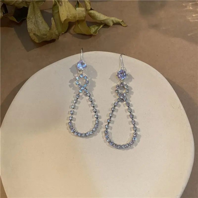 

Silver Bright Diamond Earrings Eight-Character Cross Goddess Fan Earrings Female Star Same Style Gift Party