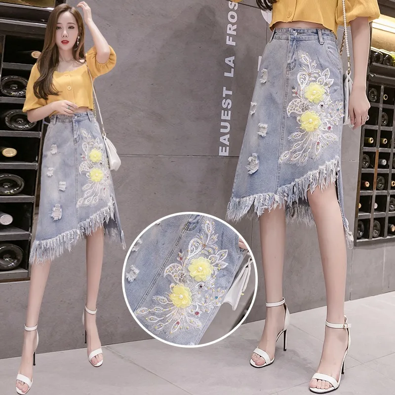 

2021 new embroidery oversized denim skirt women's fashion round hole bead irregular tassel skirt applique bag hip denim skirt