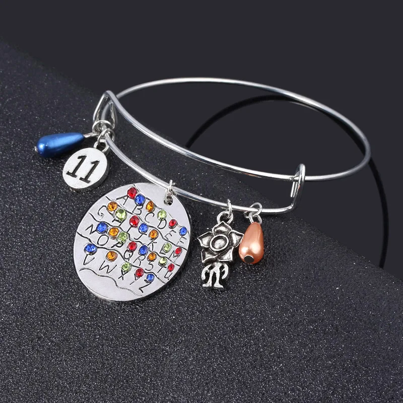 Браслеты с ужасным фильмом очень странные дела браслет лампой значок лампочкой