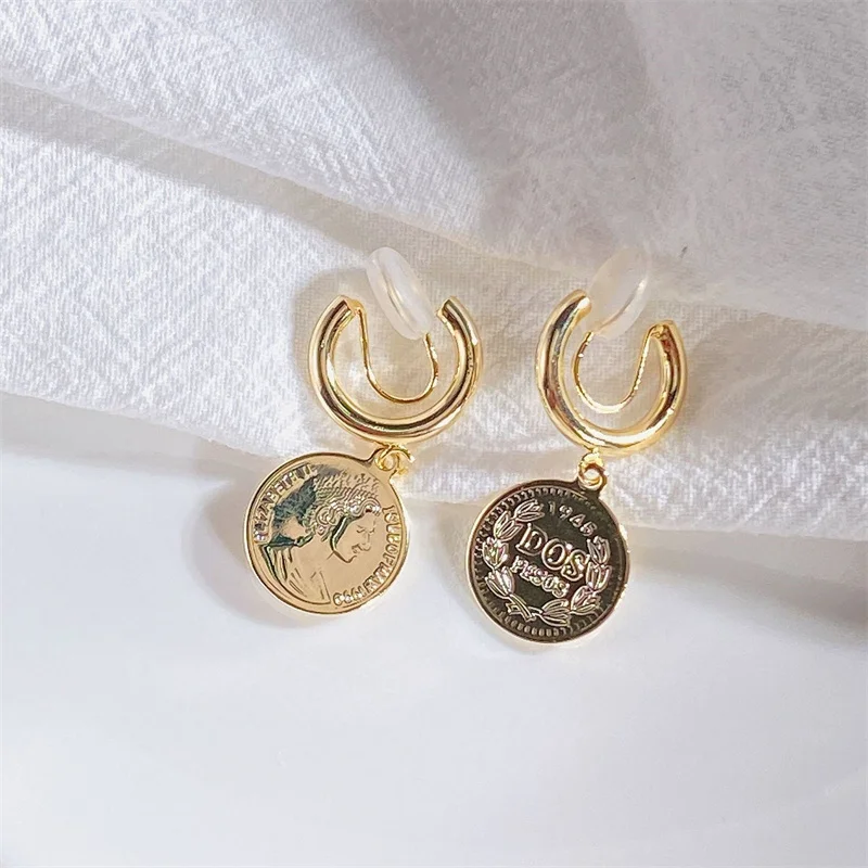 

New retro abstract character metal coin high-end sense of cold wind earrings trend nightclub party punk earrings wholesale