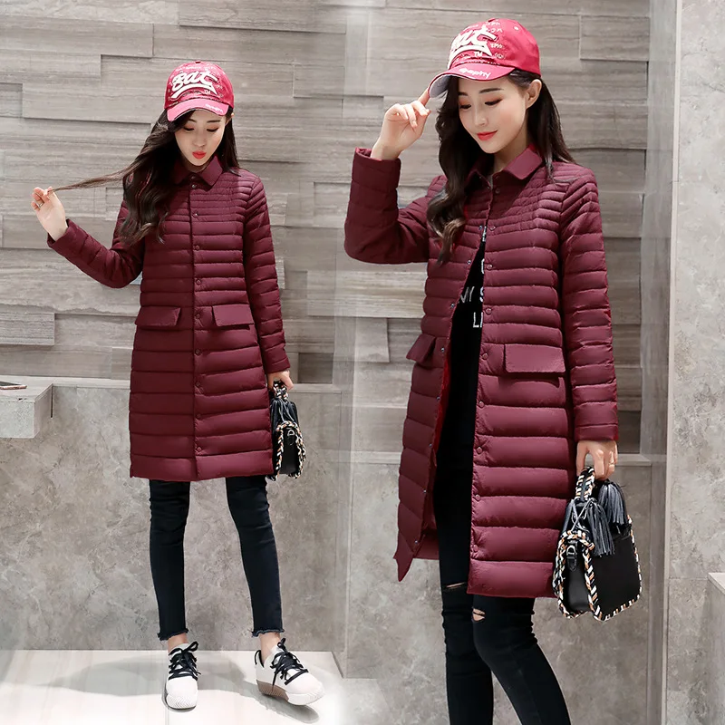 Пуховик женский осенне-зимний приталенный средней длины с отложным воротником