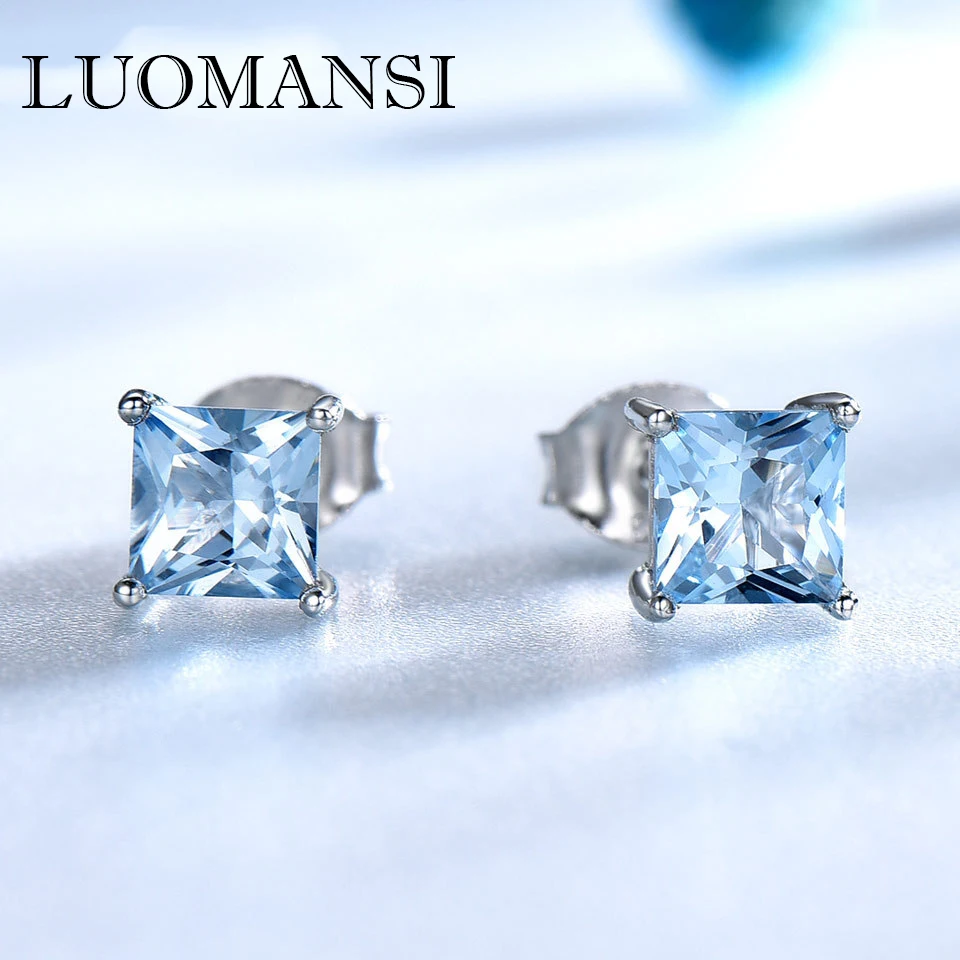 

Серьги-гвоздики с натуральным квадратным голубым топазом