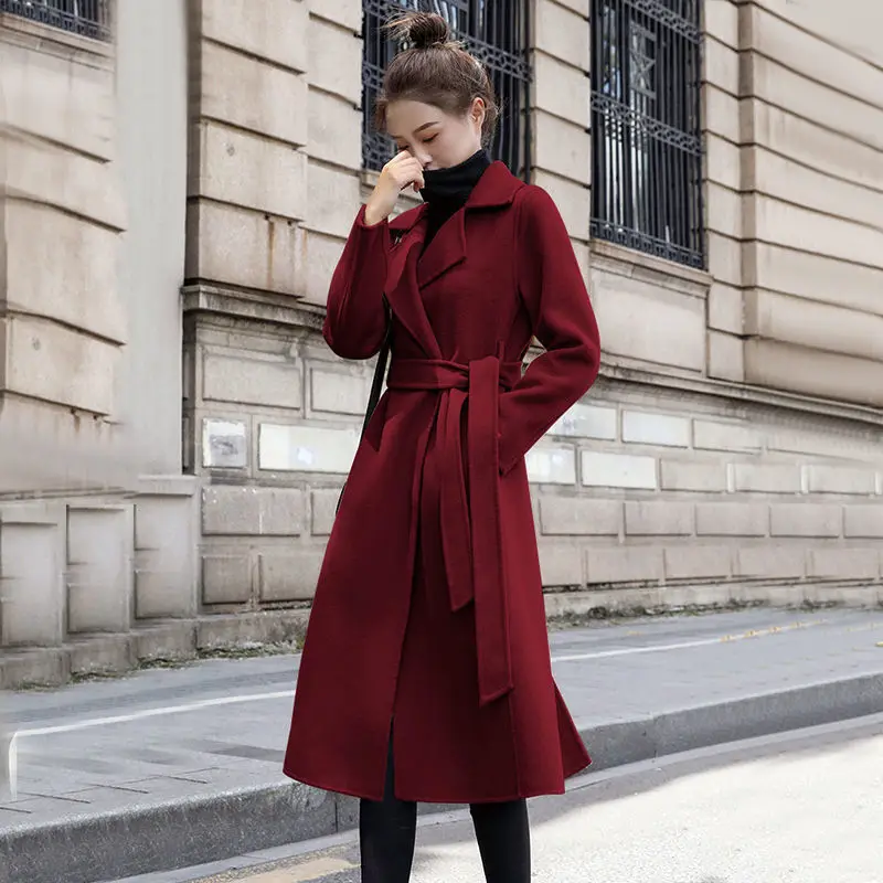 

Осенне-зимнее черное пальто для женщин, новинка 2021, трендовая ветровка, шерстяное пальто средней длины, модная женская куртка с поясом