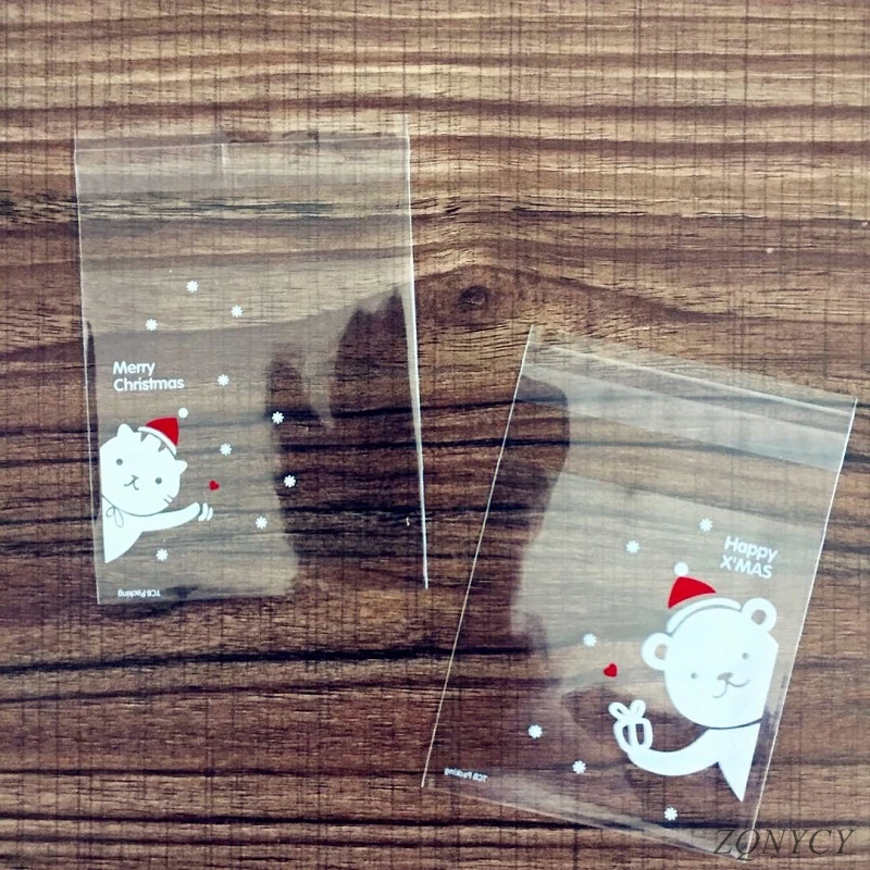 

100Pcs Christmas Candy Bags Cute Plastic Gift Cookies Packaging Bags Biscuits Snack Candy Cake Packing Bags for Xmas Decoration