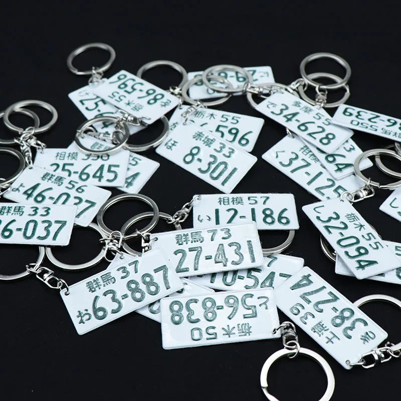 1pcs random delivery JDM автомобильный гоночный номерной знак брелок японский номерной знак модифицированный номер карты брелок - Название цвета: 1pcs random delivery