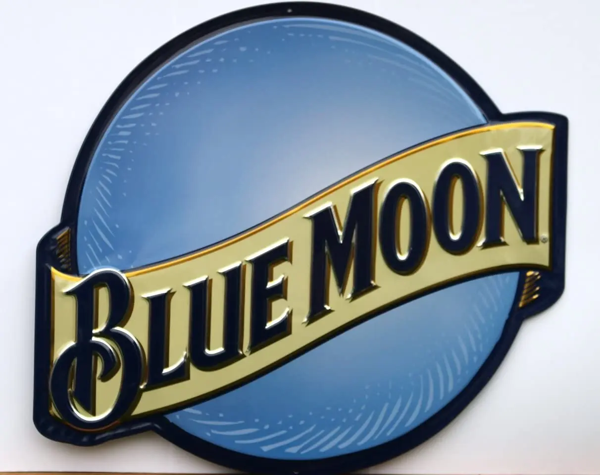 

Blue Moon Tin Sign by Ande Rooney
