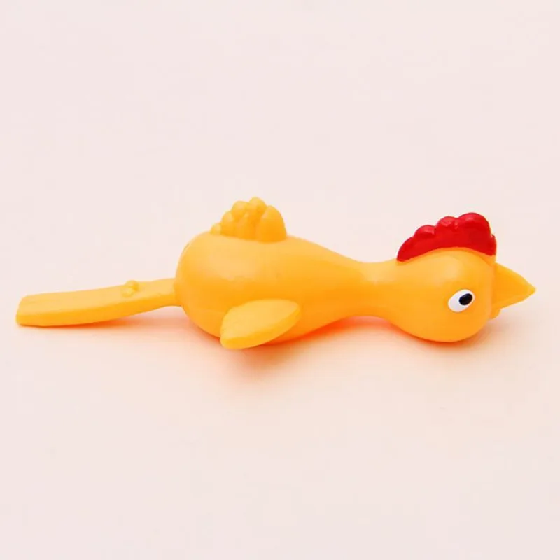 

Flying chicken little yellow slingshot toy stick to the wall fun launching chicken slingshot finger soft glue