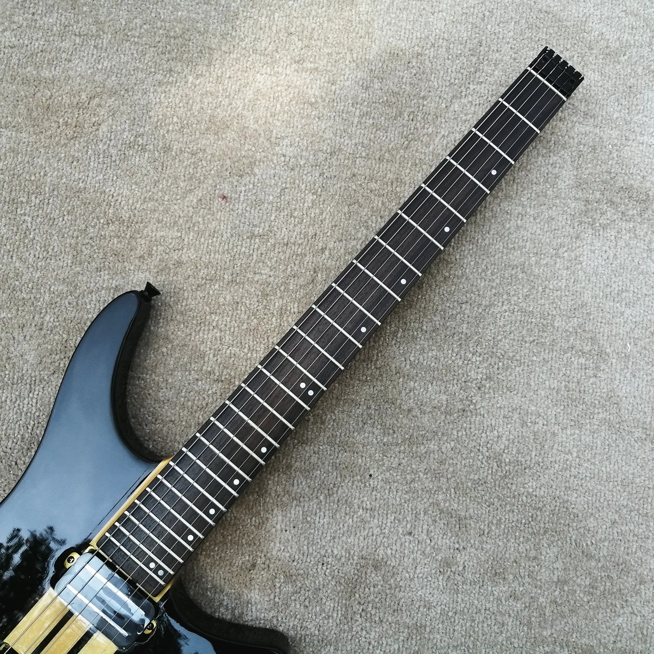 

IN STOCK,good quality Grote 6 Strings headless Electric Guitar,amazing black color,through neck,ebony fingerboard,Free Shipping