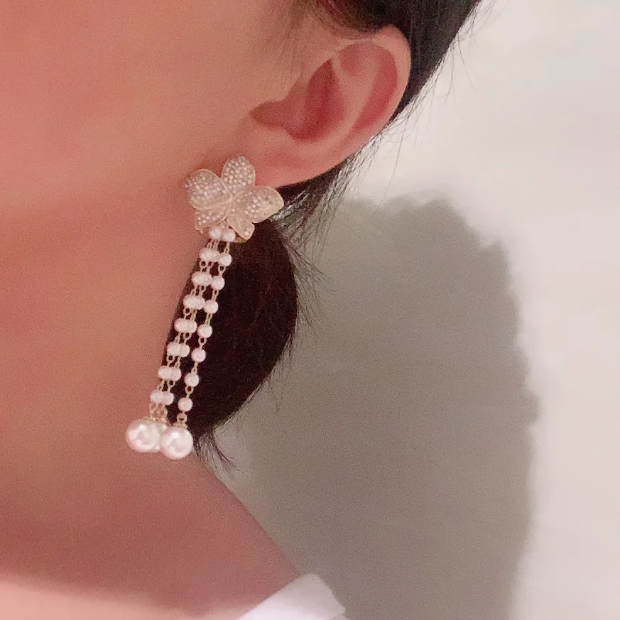 

Metal leaf earrings female super fairy temperament Pearl tassel sweet bridal earrings long sweet flower earrings