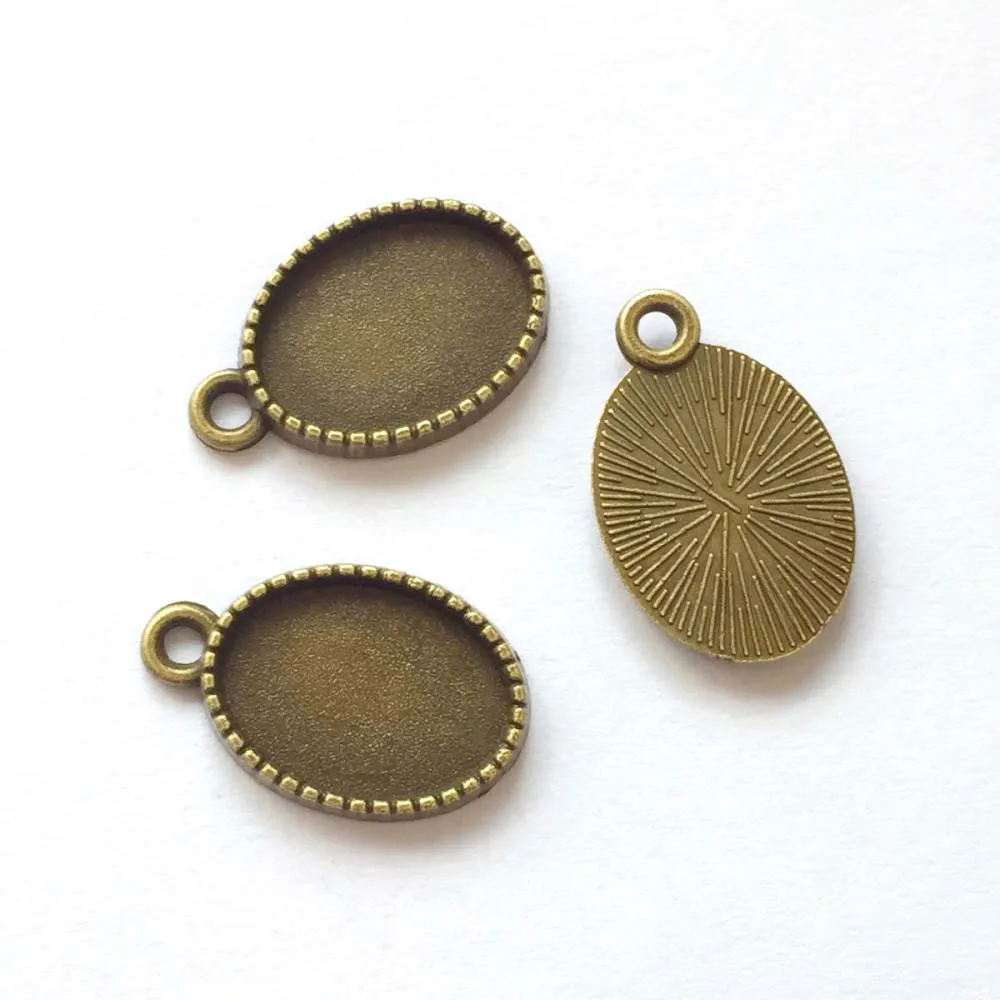 

20pcs/lot 10x14mm Necklace Pendant Setting Antique Bronze Glass Cabochon Blank Base Supplies for Jewelry T417