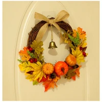 home decoration with pumpkin maple leaf bell on the door of thanksgiving and halloween garland