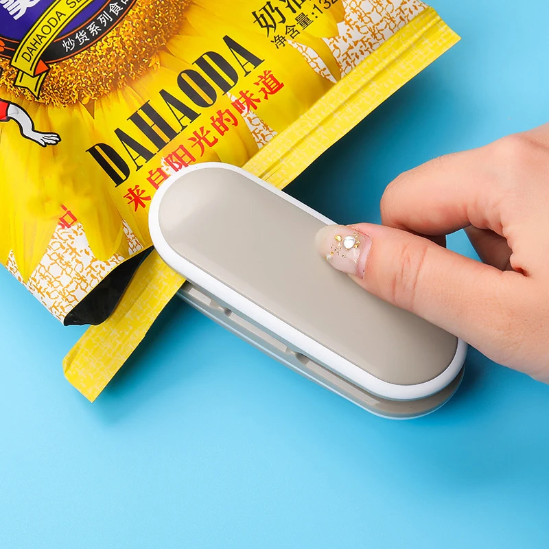 

Mini Capper Portable Heat Sealer Snacks Plastic Bag Open Tools Household Food Preservation Hand Press Small Sealing Machine