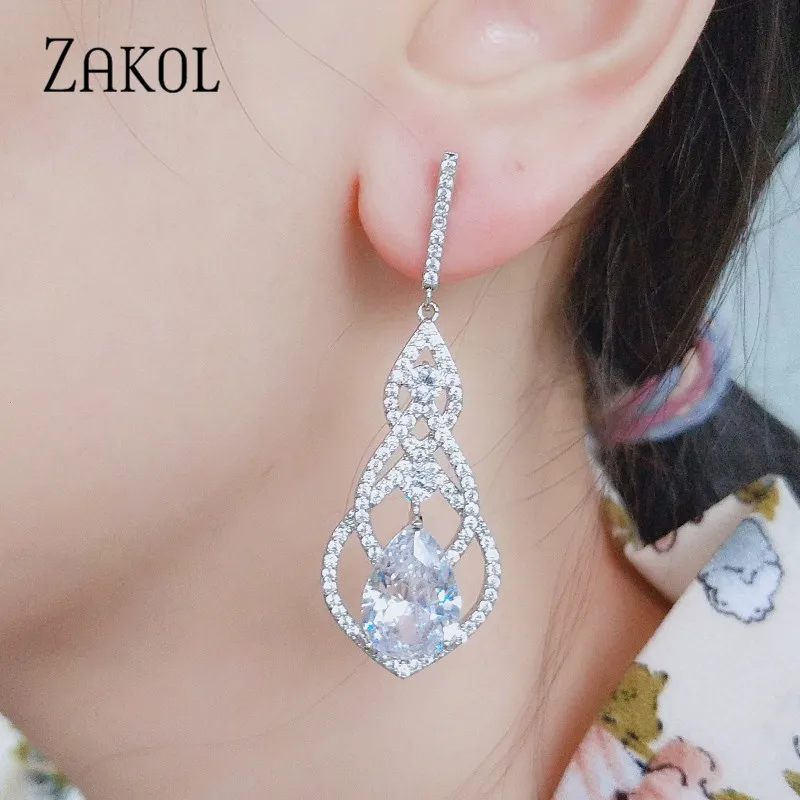 Роскошные блестящие серьги подвески ZAKOL с фианитами для невесты украшения