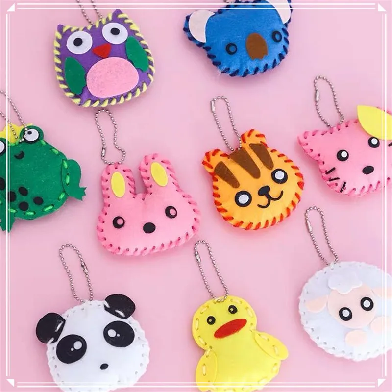 10 unids/lote artesanía juguetes para los niños tela no tejida hecha a mano DIY bolsa Rosa adornos de llavero artes MANUALIDADES Kits de juguete creativo