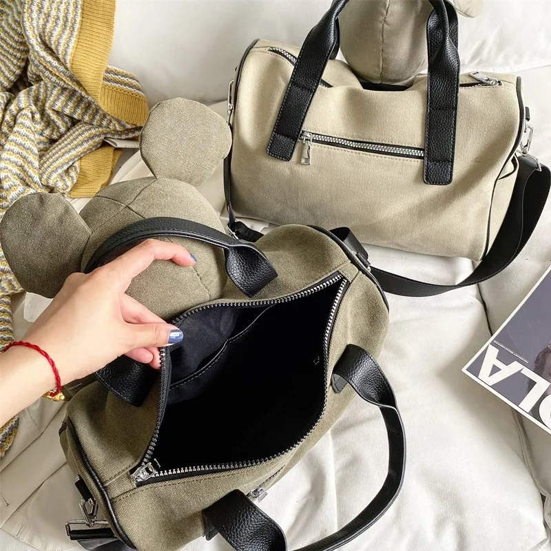 barato Disney Moda Nova 2021 Boneca Travesseiro Bolsa De Lona Militar Coreano Estudante Bolsa Ombro