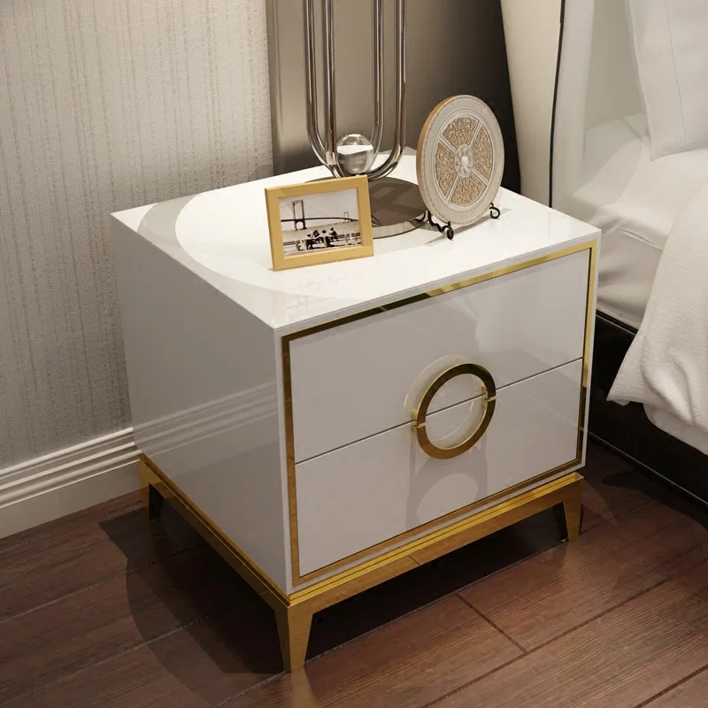 

Post-modern light luxury bedside table Solid wood drawer stainless steel hardware plating frame simple bedside table