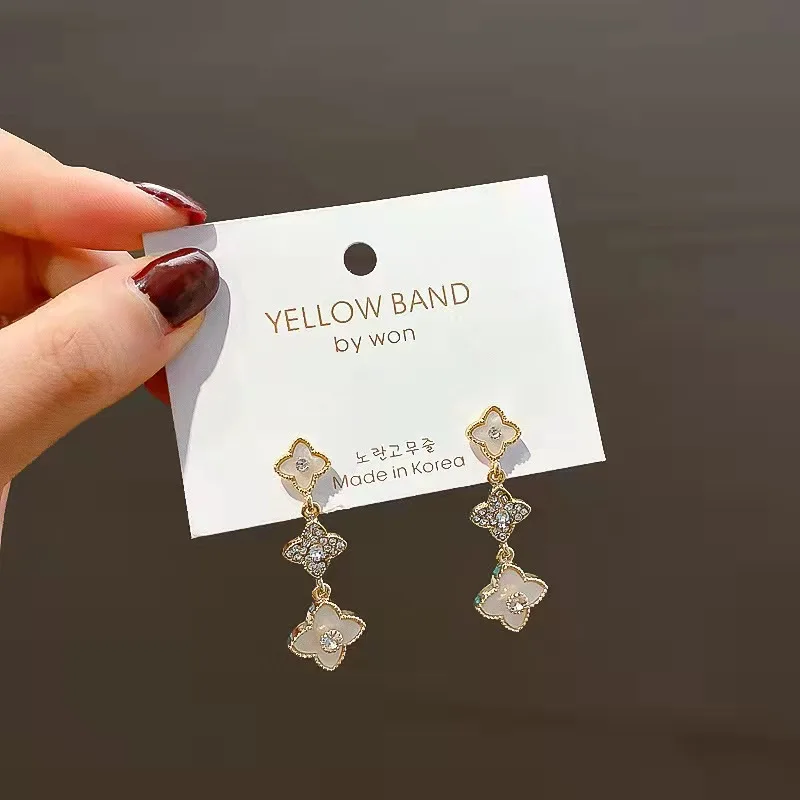 

Silver needle lucky four petal flower earrings South Korea temperament net red long tassel earrings elegant new free shipping