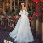 Кружевное свадебное платье-трапеция из тюля с V-образным вырезом и открытой спиной