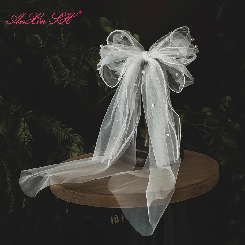 

Свадебная фата AnXin SH свадебный цветок для невесты, белая Фата в Корейском стиле длиной около 60 см с белым бантом и жемчугом, обруч для волос п...