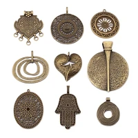 2pcs antique bronze heart flowerhandsbutterflyleaf round crosselephant craft pendant for pendant necklace jewelry making