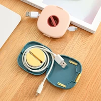 new small portable round rotatable data cable organizer storage box mobile phone charging cable winder can be carried with you