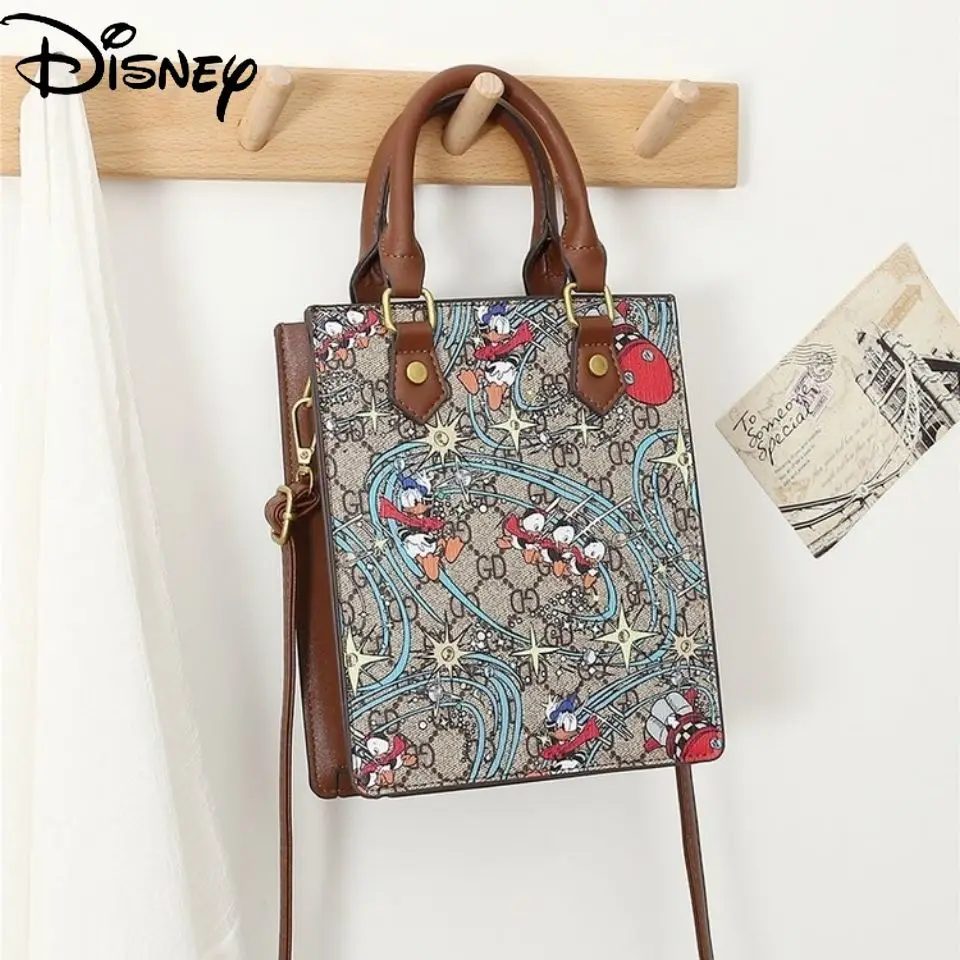 

Disney 2021 New Cartoon Cute Portable Messenger Graffiti Donald Duck Printing Pu Female Bag Casual All-match Zipper Tote Bag