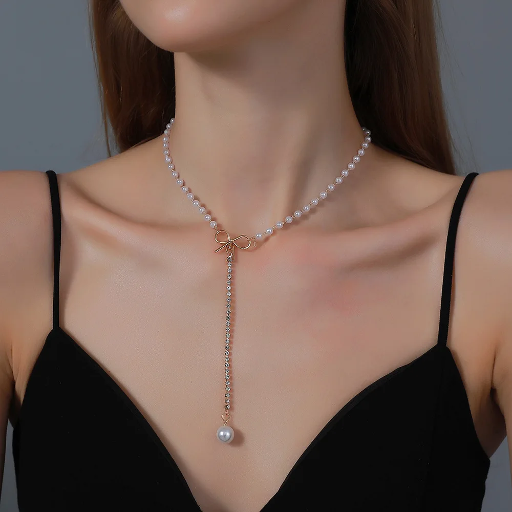 

Gargantilla de cuentas Vintage para mujer y nina, Collar de cadena con diamantes de imitacion de colgante perla, lazo romantico