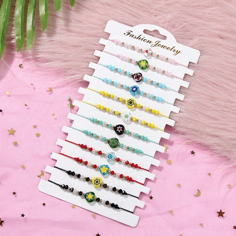 

Bohemia 12pcs/lot Woman Men Handmade Adjustable Rope Chain Bracelet Crystal Bead Heart Flower Charms Bracelets Couples Jewelry