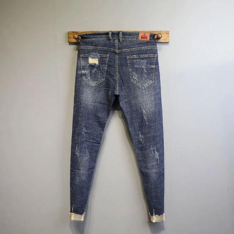 

Wholesale Denim jeans men's Korean style trend wild Ripped hole social spirit guy pants small trousers thin pencil pants2021