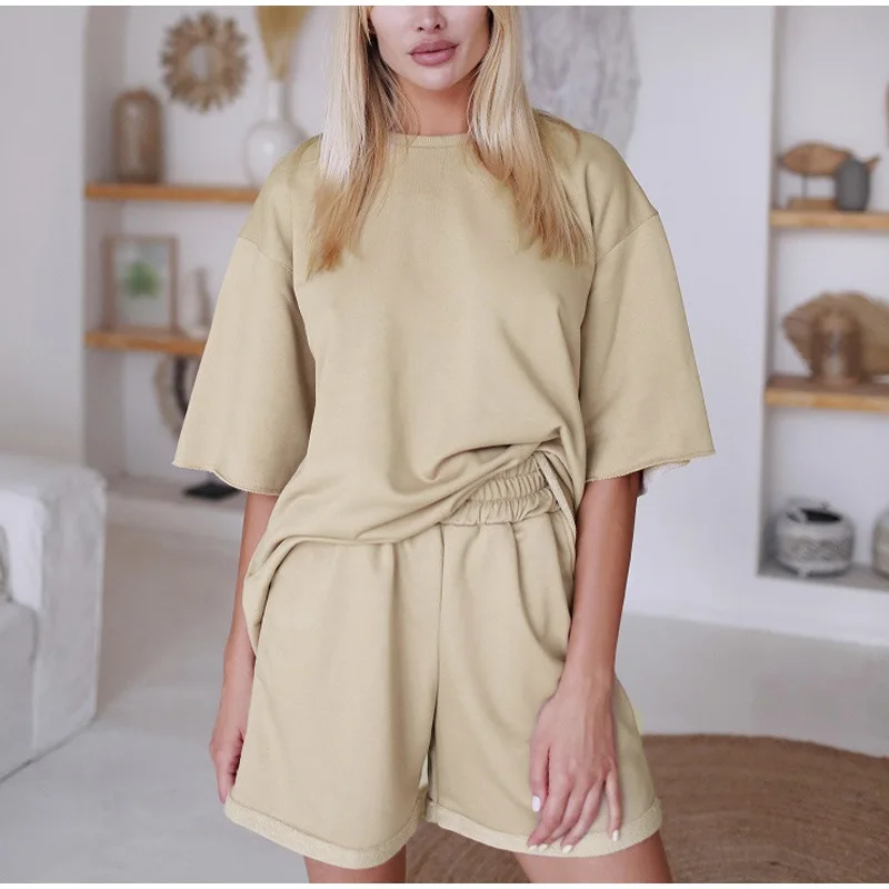 

2021 Summer Fashion Sports Set Two-Piece Women's Solid Color Half Sleeve Round Neck Top Tee Loose Elastic Waist Shorts Flanging