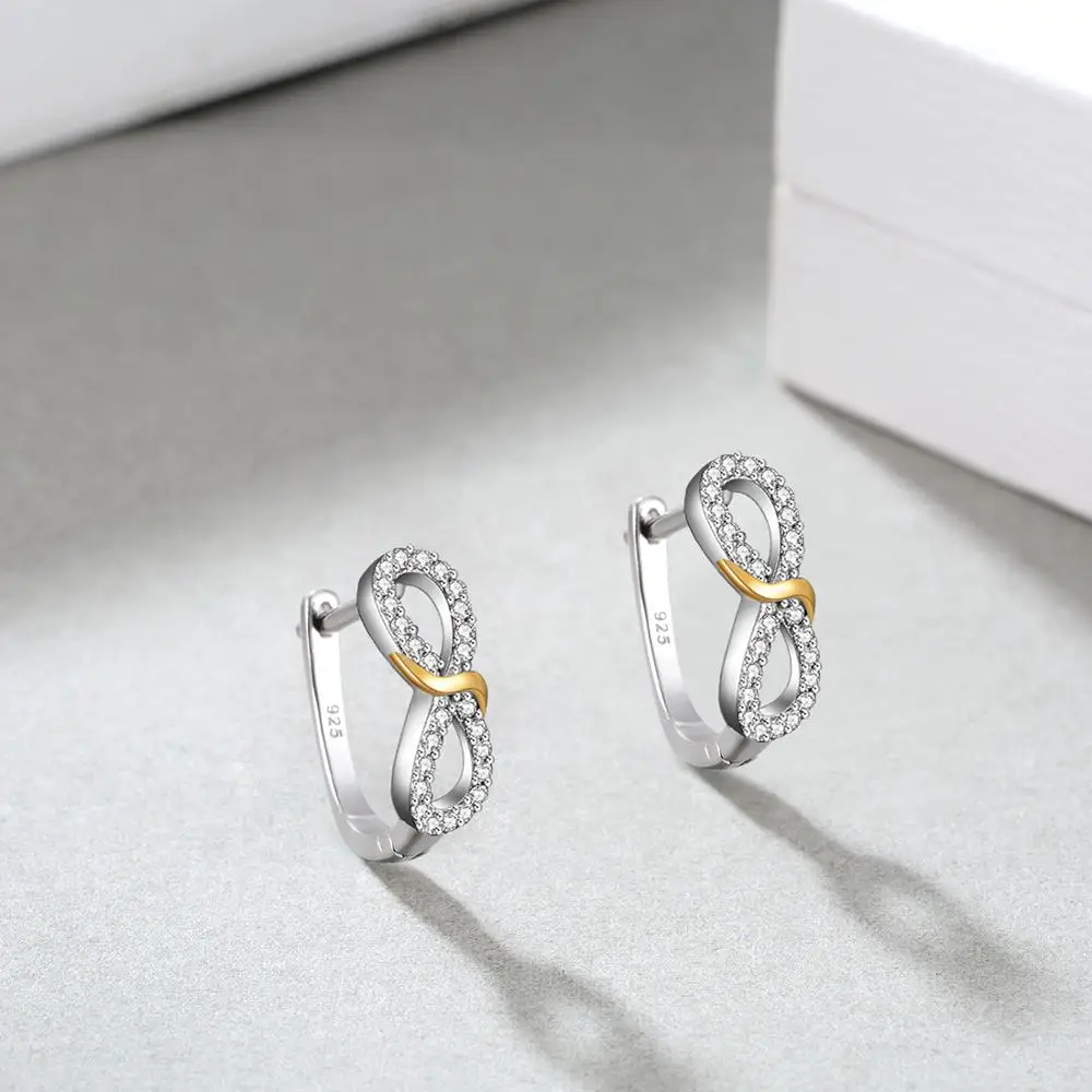 Серьги-гвоздики в виде знака бесконечности серебряные украшенные золотым