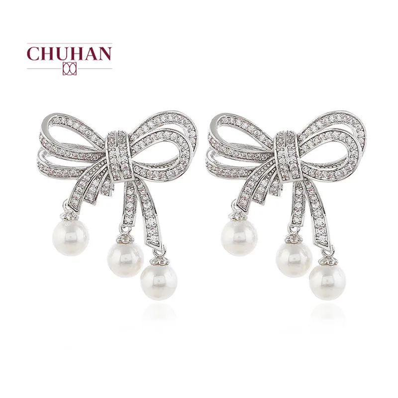 Женские серьги-гвоздики в виде банта золотого и серебряного цвета | Украшения