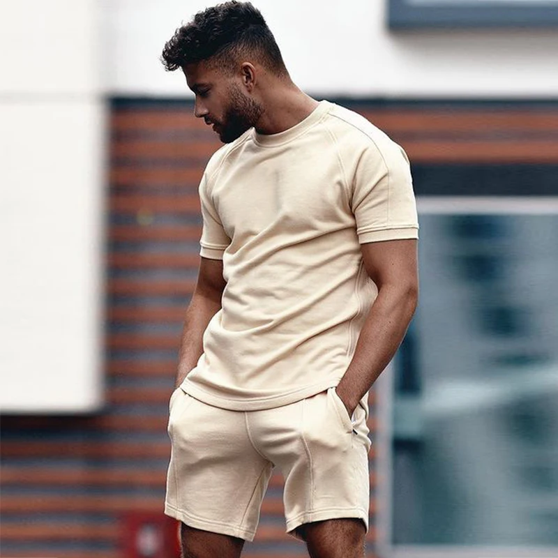 

2021 летний повседневный комплект из двух предметов, женский спортивный Однотонный мужской костюм, футболка с круглым вырезом и шорты с кулис...