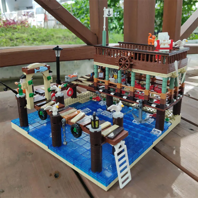 

UG30101 Ideas Creator expert Street View Fish House Pier Captain Wharf Shipyard Moc Modular bricks Model Building Blocks Toys