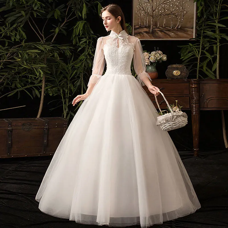 Белое свадебное платье с воротником-стойкой романтичное длинным рукавом тюль