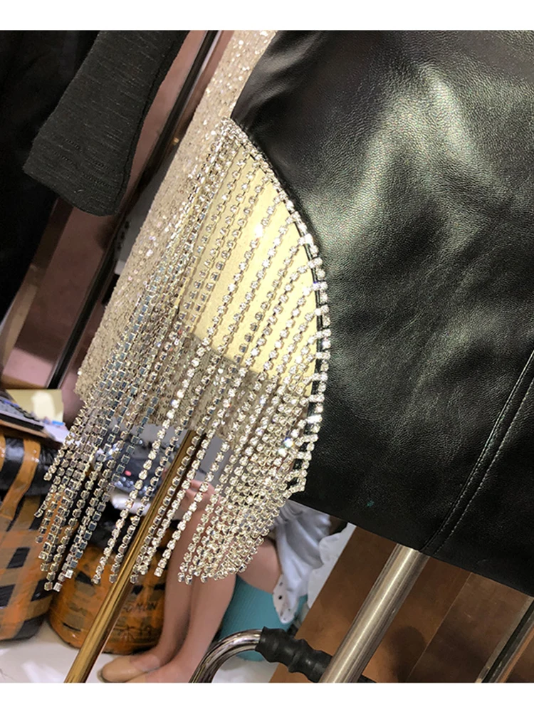 

Heavy craft high waist side drill chain tassel irregular PU leather skirt ladies spring and autumn personality package hip skirt