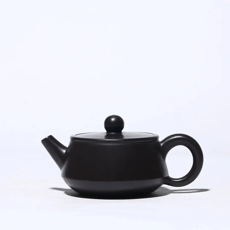 

Black clay teapot handmade by famous artists