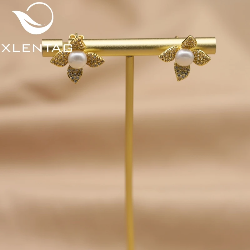 

Xlentag Brass Gold-Plated Four Petals Freshwater Pearl Earrings Women'S Wedding Fashion Exquisite Gift Jewelry Ge1108
