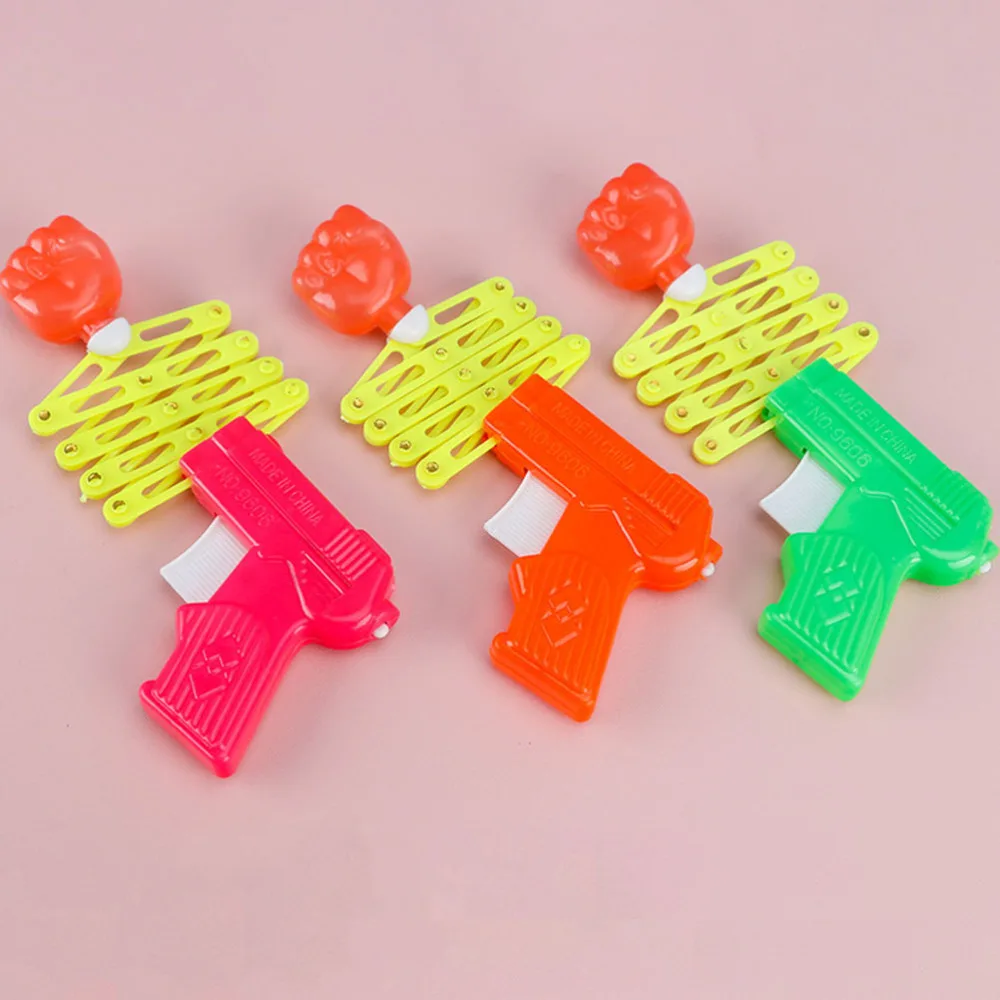

10 Pcs Children's Retractable Fist Shooter Trick Spring Guns Kids Gift