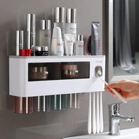 magnetic adsorption inverted toothbrush holder automatic toothpaste dispenser with cup toothpaste bathroom accessories set