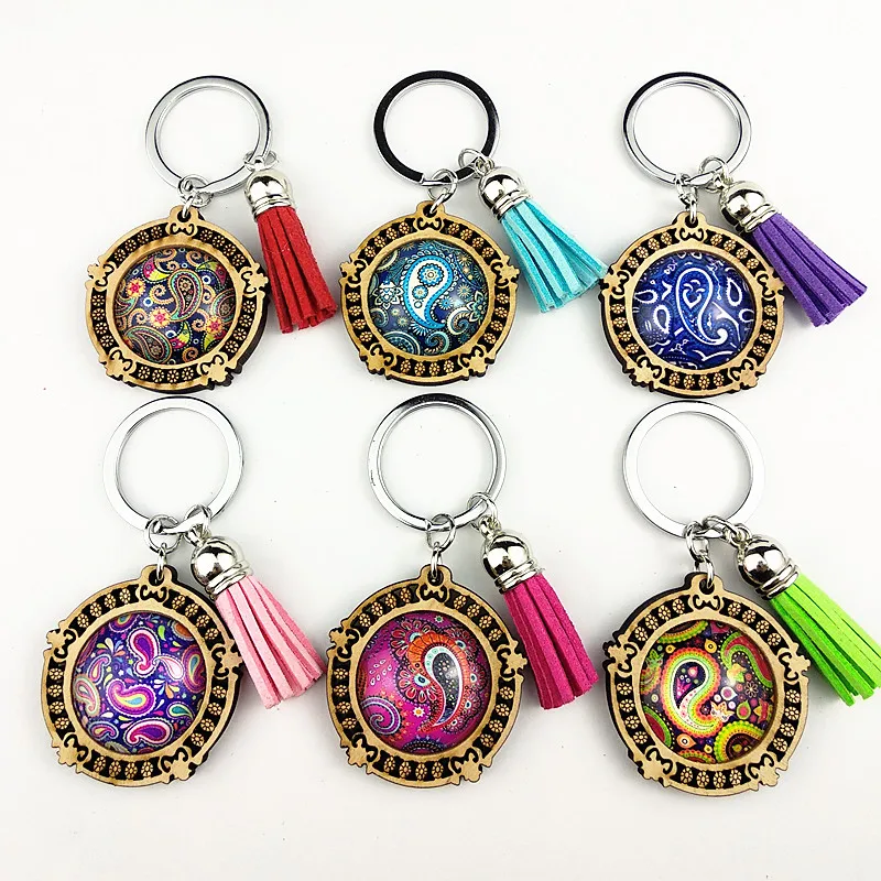 

Jiangzimei24pcs new design Bandala mandala 25mm Wood Cabochon Stainless Steel Indian retro Keychain with tassels glass Cabochon